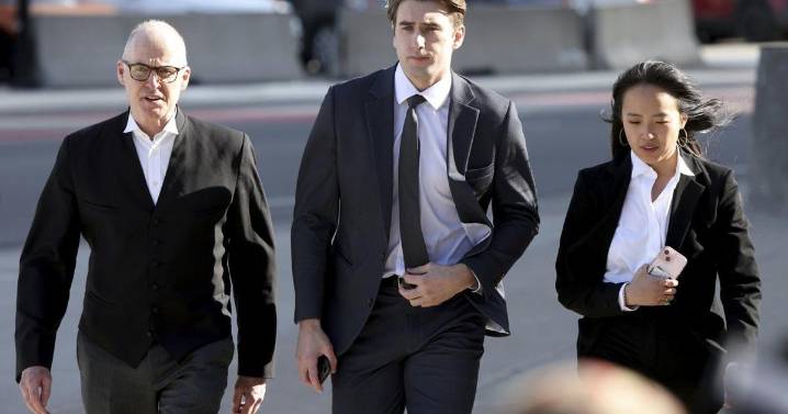 Michael McLeod, one of the players acquitted in Hockey Canada sexual assault case, signs in the KHL
