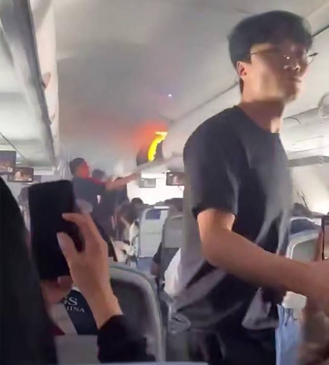 Terrifying moment fire breaks out on plane travelling at 33,000ft