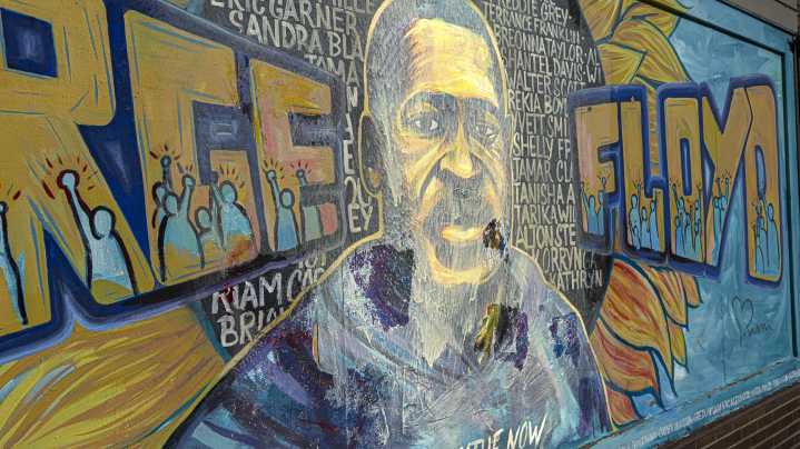Activists, artists work to restore vandalized George Floyd mural