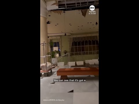 Tourist shows damage from Hurricane Melissa