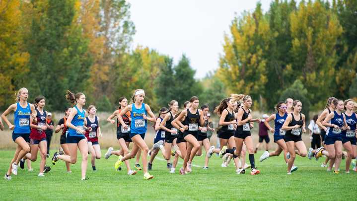 Race day photos: Local cross country runners win league titles