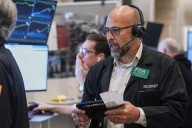 Wall Street veers upward after Trump softens his criticism of China