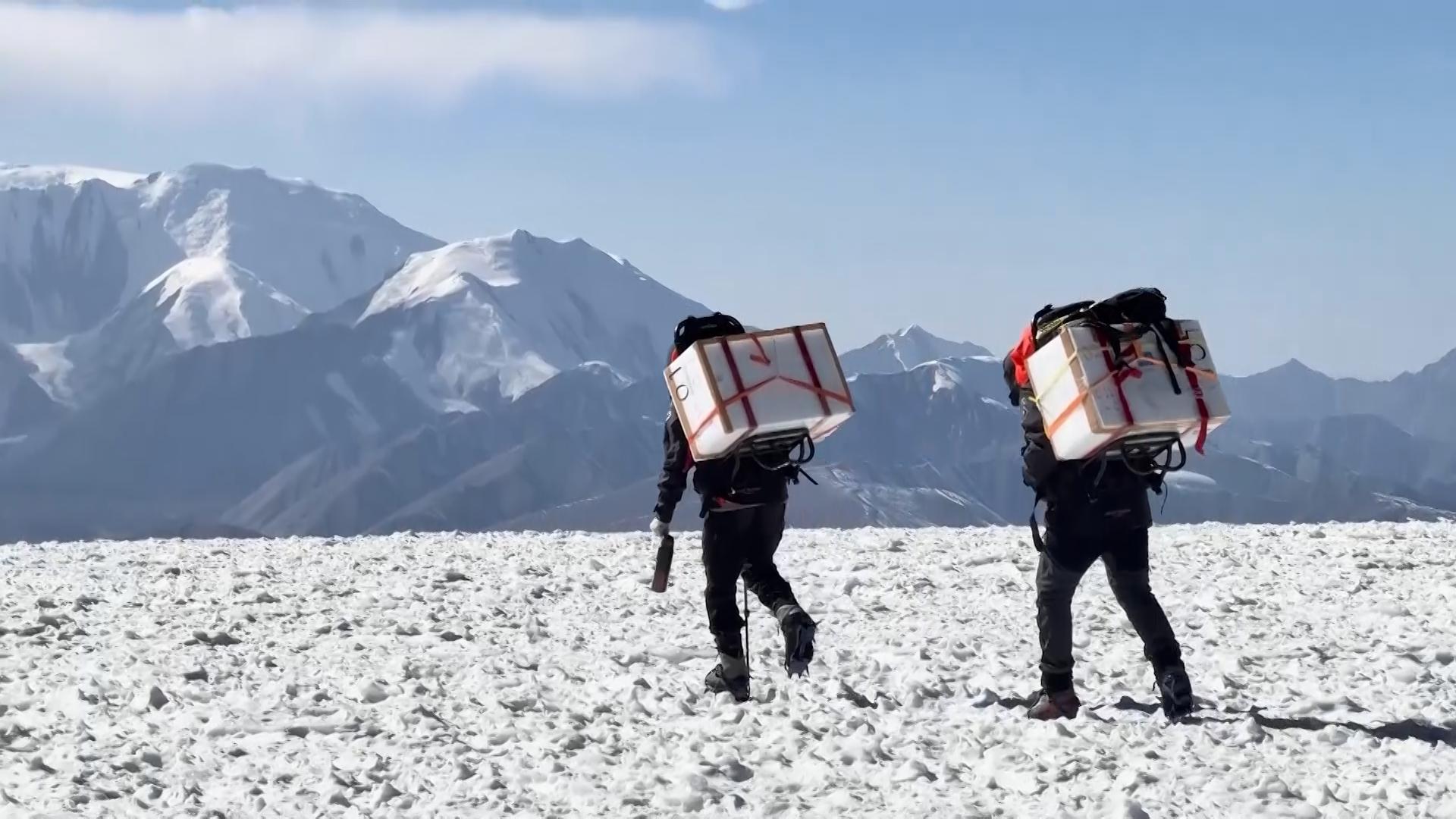 Scientists trek Tajikistan mountains to obtain ice core samples to learn about global warming