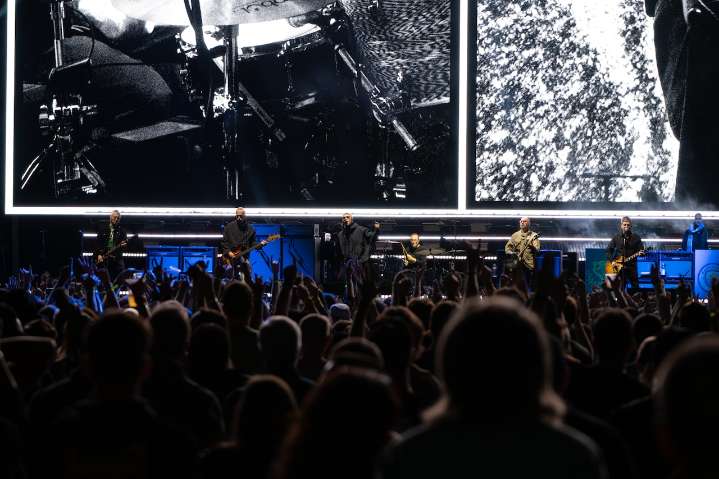 Beloved rock band’s guitarist steps away from world tour amid cancer battle