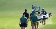 Vince Whaley has an audience with a set of teeth. He hits shot with alligator behind him