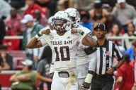 Reed throws for 280 yards and 3 TDs, runs for another score as No. 4 Texas A&M beats Arkansas 45