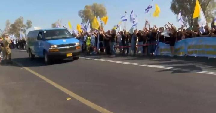 Convoy carrying released hostages escorted across border into southern Israel
