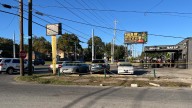 Police: Suspect in custody after shots fired at Dixie Highway business