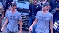 Enrique Iglesias Looks Dapper In 'Party Naked' T-Shirt, Waves At Paps As He Arrives In Mumbai Ahead Of His Concert
