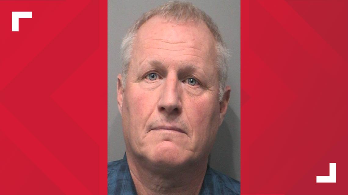 Johnson County coroner booked into jail on 14 charges
