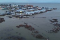 Officials airlift evacuees to safety after the remnants of Typhoon Halong devastate Alaska villages