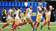 Short-handed 49ers stop Rams on downs in overtime, preserving a 26
