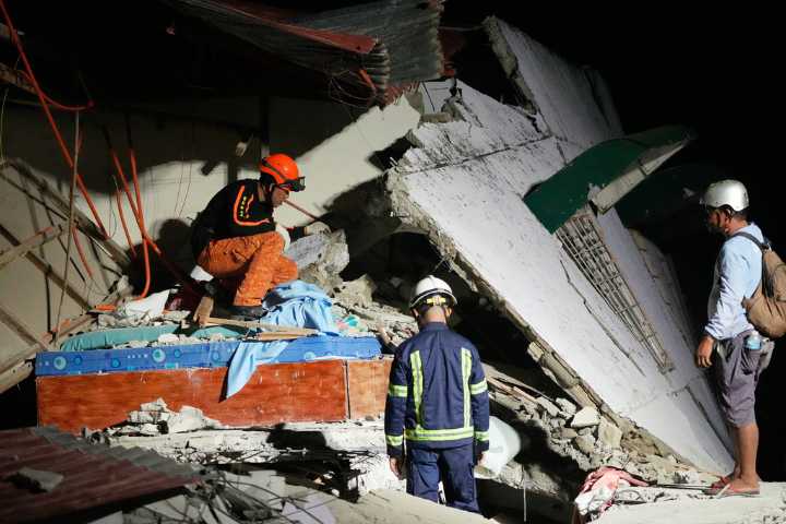 Rescuers desperately search for survivors of earthquake in the Philippines that killed at least 72