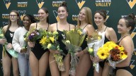 Waubonsie Valley girls swimming coasts by Naperville Central on Senior Night
