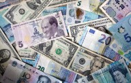 Dollar falls after weak U.S. jobs data, shutdown fears