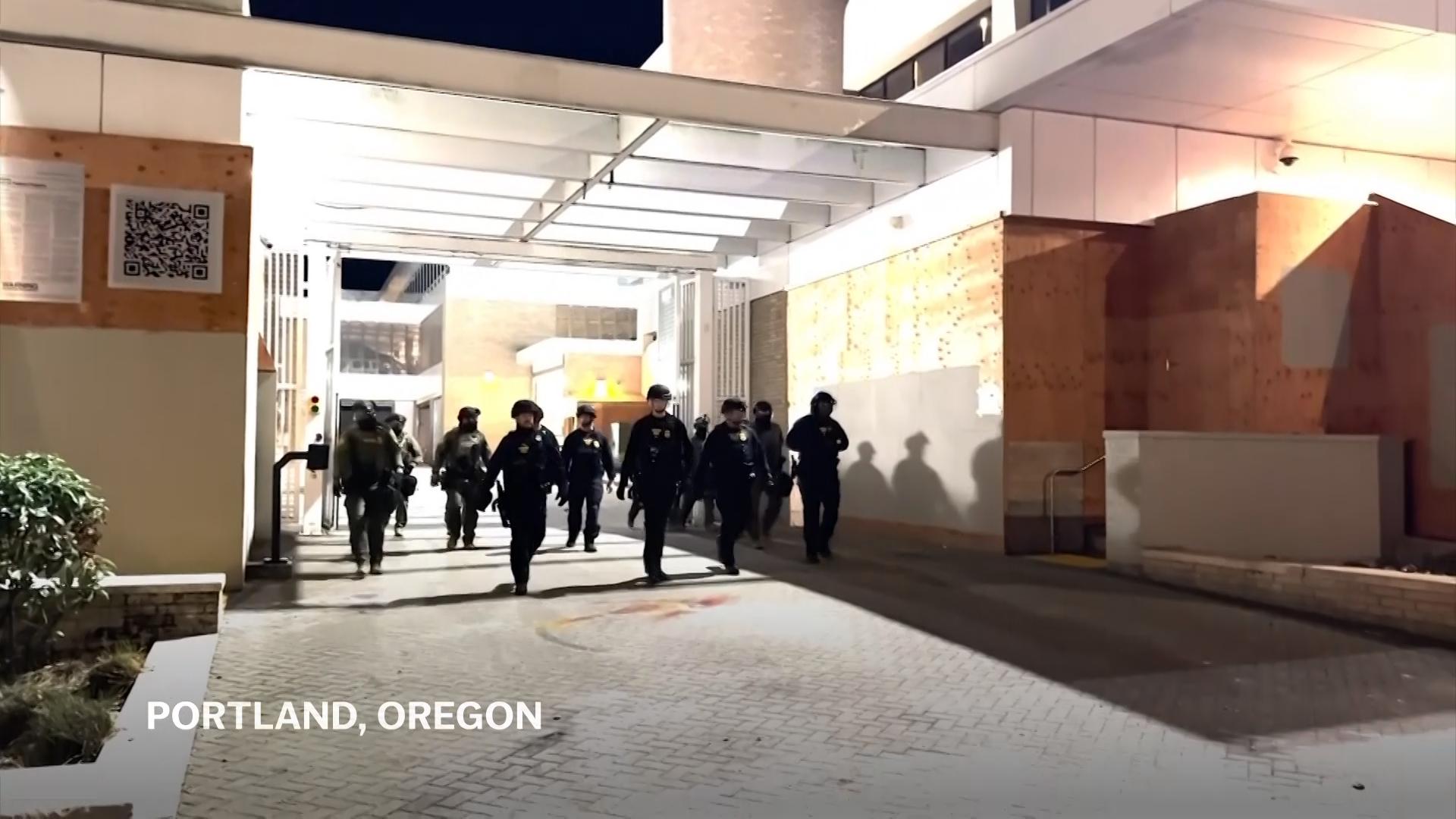 Protesters and officers face off outside Portland, Oregon ICE facility