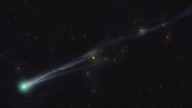 Two greenish comets are streaking across the night sky this month