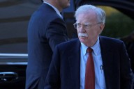 Bolton arrives at court to surrender to authorities on charges in classified information case
