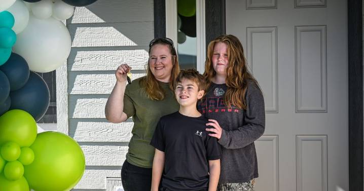 First Story gifts keys to Spokane family during home dedication event