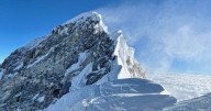 Mount Everest snowstorm traps almost 1,000 people as rescuers race to camps