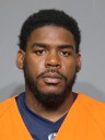 CMS coach arrested, accused of shooting into occupied property