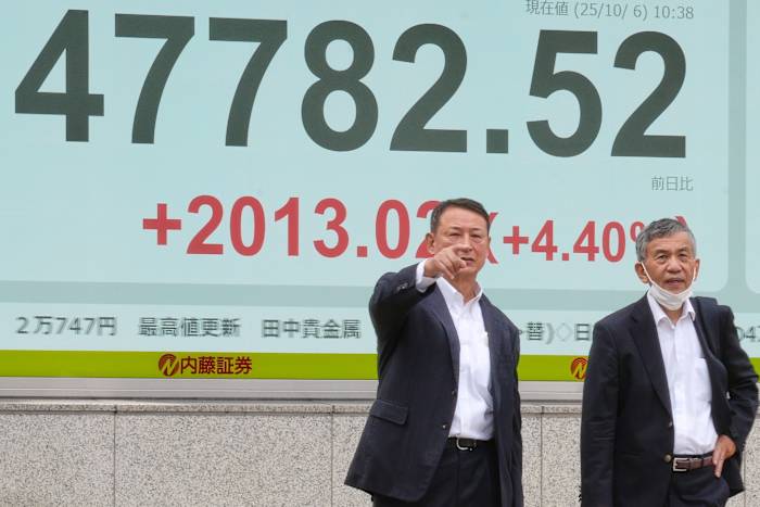 Asian markets mostly higher in quiet holiday trading after AI deals push Wall St to more records
