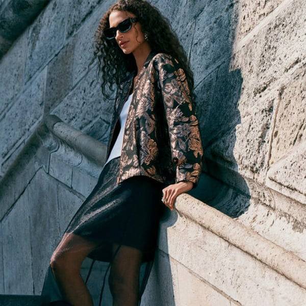 Buoyant Next sales power ahead in UK and Europe, raises guidance