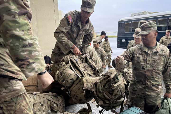 Officials airlift evacuees to safety after the remnants of Typhoon Halong devastate Alaska villages