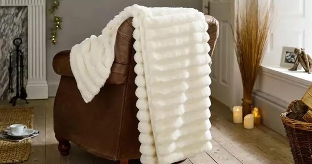 Cloud-like fur throw heavily reduced from £120 shoppers call 'soft and luxurious'