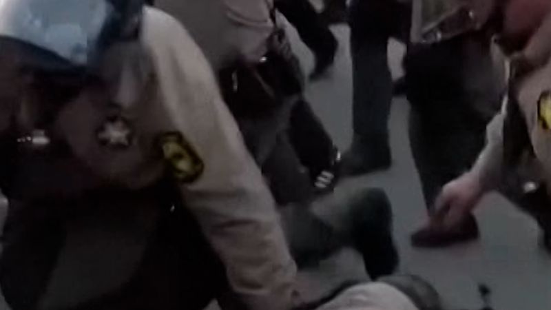 Protesters clash with police outside ICE facility