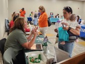 Community baby shower offers resources for new and experienced moms