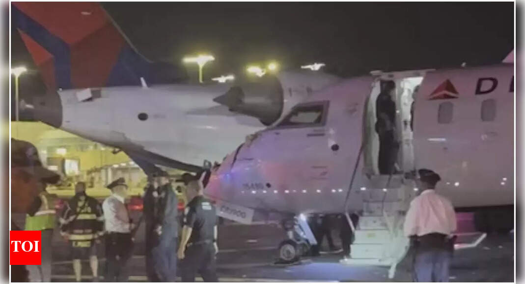 Two Delta planes collide while taxiing at LaGuardia Airport in New York; wing of one plane detached