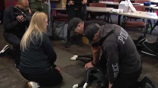 First responders get hands-on K9 first aid training from veterinarian