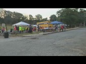 Volunteers for 'No Kings' protests prepare for demonstrators to rally