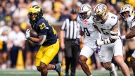 Michigan football keeps CFP hopes alive by stuffing Washington, 24