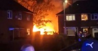 Homes evacuated and emergency crews tape off street as huge fire erupts in south Manchester
