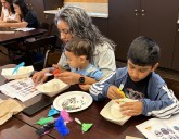 Locals decorate sugar skulls in advance of the Day of the Dead