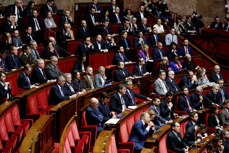 French PM expected to survive two no-confidence votes on day of reckoning