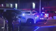 Suspect held knife to woman's throat before Phoenix officers opened fire, police say