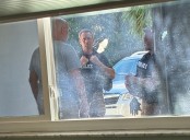 Agents visit couple who sent critical postcard to Florida CFO