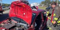 Driver trapped in car after a collision on I