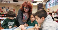 Whiting students spread kindness through coffee sleeves