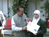 Jitendra Singh distributes free laptops to top