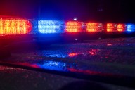 Woman dies after getting pinned between two cars trying to tend to infant in Lawrence