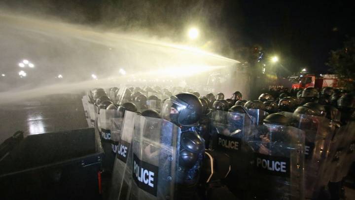 Georgia's police use water cannons to push back protesters trying to storm presidential palace