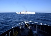 China Deploys Navy To Help Coast Guard Squeeze US Ally