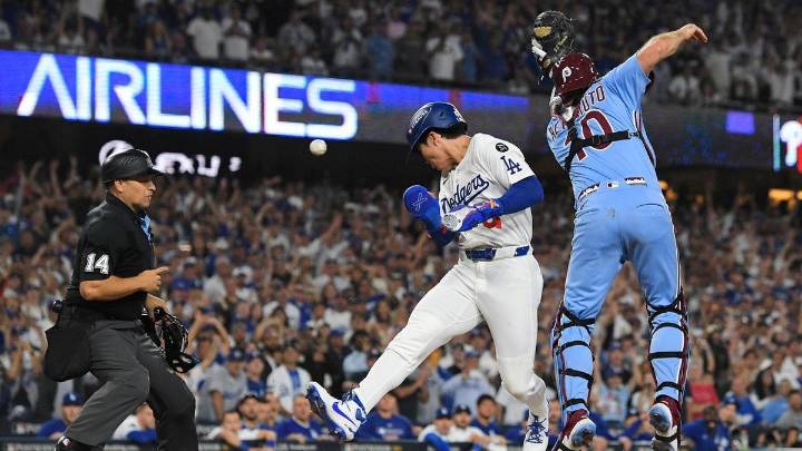 Dodgy throw helps LA advance in MLB playoffs