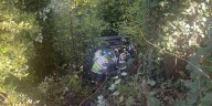 Driver hospitalized after pickup crashes down ravine near Newberg
