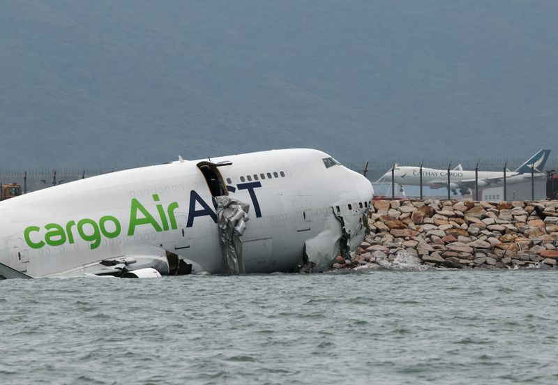 Cargo plane slides off runway in Hong Kong, media reports two dead
