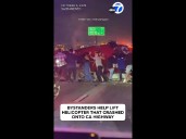 Bystanders help lift helicopter that crashed onto CA highway